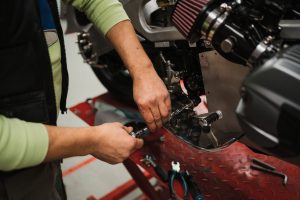 Motorcycle repairs in Logan village.